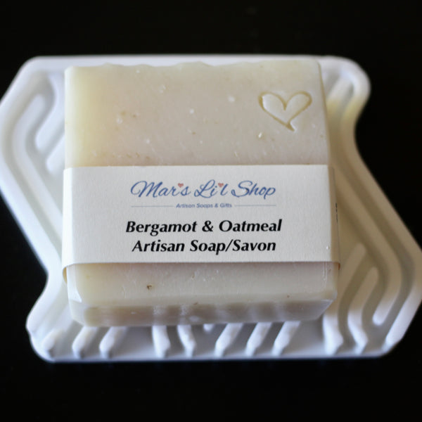 A comforting blend of finely ground oatmeal and uplifting Bergamot essential oil, this cold process soap gently exfoliates while nourishing the skin. Enriched with luxurious oils and butters, it leaves your skin soft, smooth, and lightly scented with a fresh, citrusy warmth, perfect for a soothing, everyday ritual.