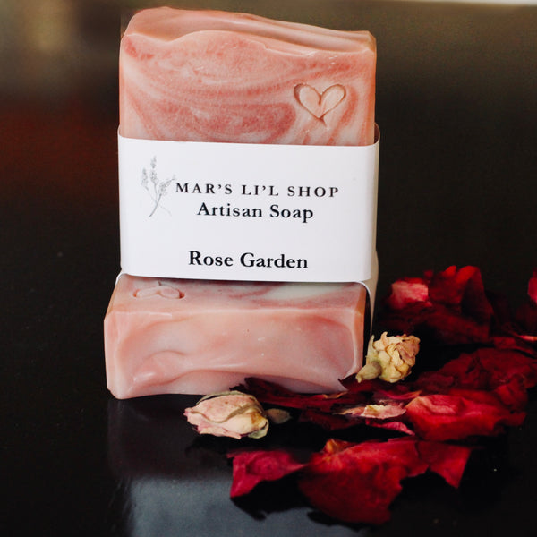 A luxurious cold process bar infused with the delicate, rosy scent of Geranium essential oil. A soft red swirl dances through the soap, creating a captivating design. Enriched with nourishing oils and butters, it gently cleanses while leaving your skin soft, smooth with its floral charm.